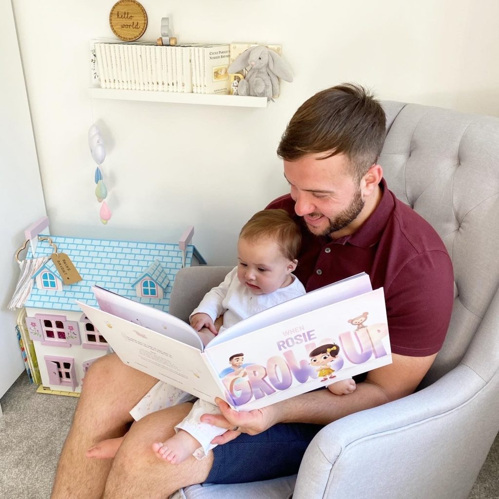 Dad reading to his little girl